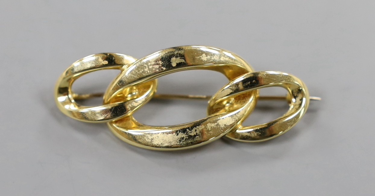 A mid to late 20th century Italian 750 yellow metal triple oval link brooch, 46mm, 4.9 grams.